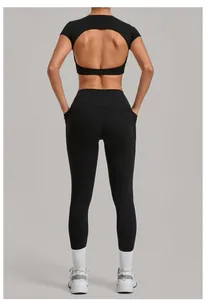 Back view of black yoga set featuring open-back cutout top and slimming leggings.