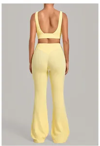 Back view of yellow yoga set featuring a sports bra and high-waisted flared workout pants