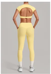 Back view of yellow two-piece yoga set featuring a stylish open-back cutout design
