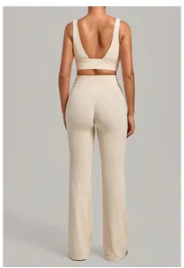 Back view of beige flared yoga pants and sports bra set with high waist design