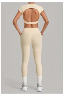 Back view of cream 2-piece yoga set featuring open back top and high-waisted leggings