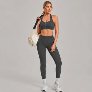 Two-piece charcoal grey zip-up sports bra and butt-lifting yoga leggings set for women