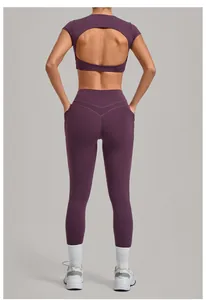 Back view of a purple yoga set with an open-back top and high-waist pocket leggings