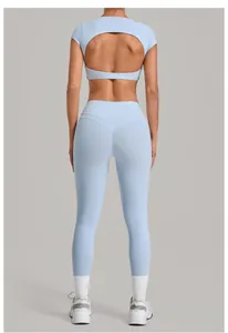 Back view of a light blue two-piece yoga set with a cut-out top and high-waist leggings.