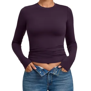 Premium purple tight-fitting long-sleeve yoga top designed for high-impact fitness
