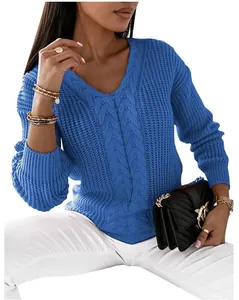 Detail view of women's blue V-neck cable-knit sweater with texture and long sleeves
