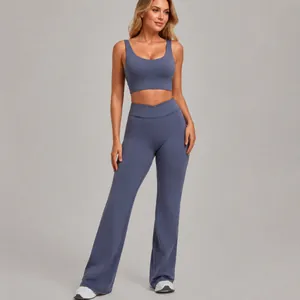 Two-piece yoga fitness set with a sports bra and high-waisted flare leggings in dusty blue