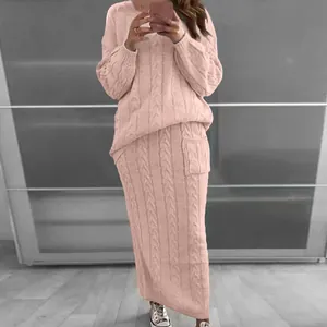 Cozy pink cable-knit sweater and long skirt set shown in a full-length mirror selfie