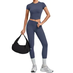 Ensemble de yoga femme bleu ardoise avec haut à manches courtes élastique et legging sport