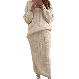 Close-up view of a beige cable-knit sweater and matching long skirt set for women