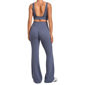 Back view of a blue two-piece yoga set featuring a sports bra and flared yoga pants.