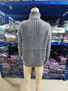Detailed back view of a solid grey thick ribbed knit turtleneck sweater for women