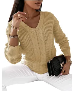 Close-up detail of a khaki V-neck cable knit sweater featuring intricate braided patterns