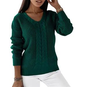 Close-up detail of a dark green V-neck cable knit sweater for women