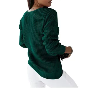 Back view detail of dark green v-neck knitted sweater with textured waffle knit