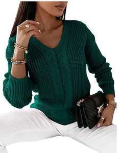 Detailed macro shot of a deep green V-neck cable knit sweater for women with long sleeves