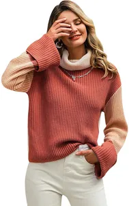 Close-up of color-block knit sweater featuring a cozy turtleneck and ribbed cuffs