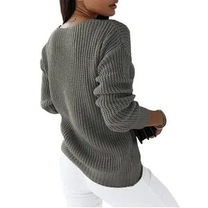 Back view detail of grey chunky knit long sleeve sweater for women featuring ribbed texture