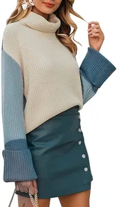 Close-up of women's turtleneck knit sweater with blue color-block design and soft texture