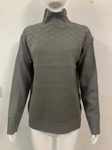 Women's grey high-neck long-sleeved sweater with decorative wavy knit pattern on mannequin