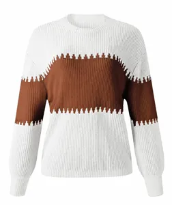 Detail of color-block knit sweater featuring lantern sleeves and jagged stripe design