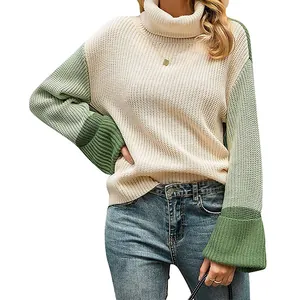 Close-up of chunky knit texture on color block turtleneck sweater for women
