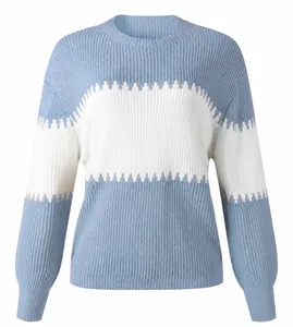 Close-up of light blue and white color block knit sweater with lantern sleeves