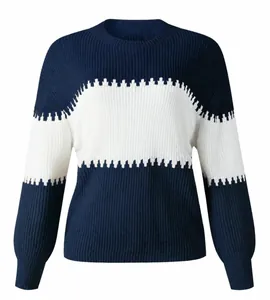 Close-up of navy and white color-block knitted sweater with lantern sleeves.