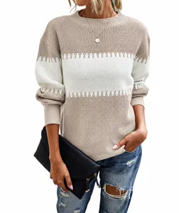 Close-up of a women's beige color-block striped sweater with lantern sleeves.