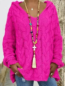 Close-up view showing the intricate fuchsia cable-knit texture on women's hooded sweater