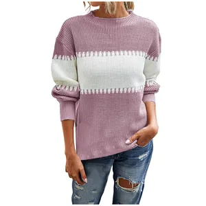 Detailed view of women's color-block striped pullover knit sweater with lantern sleeves