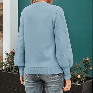 Back view of light blue round neck knit sweater with decorative sleeve patterns