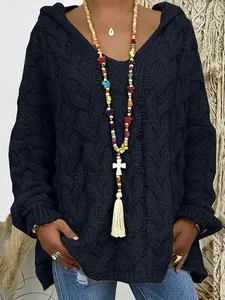 Close-up of women's black cable knit hooded sweater with V-neck and loose fit style