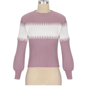 Detail view of mauve and white color-block ribbed knit sweater with lantern sleeves