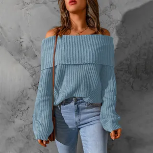 Close-up of elegant blue off-shoulder knit sweater with high-quality ribbed texture details.