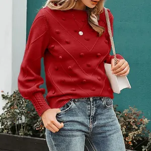 Elegant red crew neck sweater with pom-poms and chevron knit texture for women
