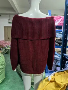 Detailed back view of a chunky knit burgundy off-the-shoulder sweater on a mannequin