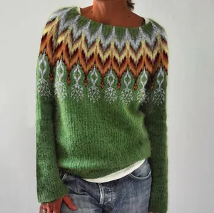 Detailed close-up of the intricate colorful jacquard pattern on this green knit sweater.