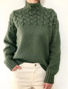 Close-up detail of a dark green cable knit high neck long sleeve sweater for women