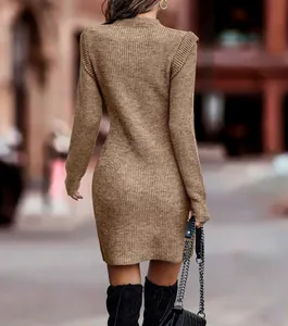 Back view of a minimalist brown long sleeve bodycon knit dress in urban street setting