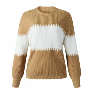 Detailed view of the color-block khaki and white knitted sweater with lantern sleeves
