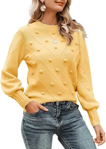 Elegant yellow crew neck sweater with pom-poms and bobble knit texture detail.