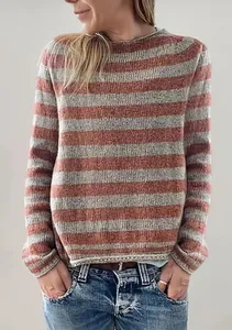 Detailed view of a women's casual striped knit sweater featuring a relaxed loose fit