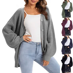 Detailed view of women's knitted cardigan showing color options and button details