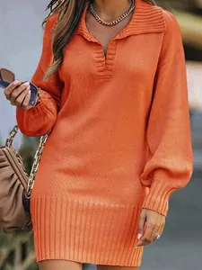 Chic orange knit sweater dress featuring long lantern sleeves and a ribbed polo collar