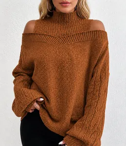 Close-up detail of a brown oversized cold-shoulder mock-neck cable-knit sweater for women