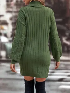Back view of green ribbed turtleneck knit sweater dress with textured lantern sleeves.