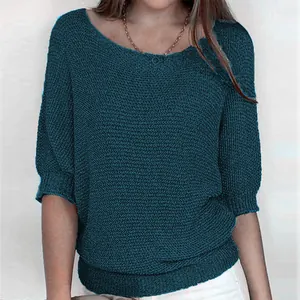 Detail of an elegant dark teal three-quarter sleeve knit sweater for women's spring style.