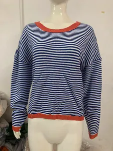 Blue and white striped knitted sweater featuring orange contrast trim and drop sleeves