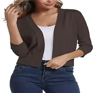 Detailed view of women's elegant dark brown cropped knit cardigan with three-quarter sleeves